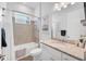 Bathroom with white vanity, a tub and shower combination, and neutral tile at 14381 Heritage Landing Blvd, Punta Gorda, FL 33955