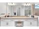 Bright bathroom featuring a double sink vanity, granite countertops, and glass shower at 14381 Heritage Landing Blvd, Punta Gorda, FL 33955