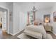 Bright bedroom featuring a chandelier, soft textures, and stylish decor for a cozy retreat at 14381 Heritage Landing Blvd, Punta Gorda, FL 33955