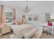 Bedroom with hardwood floors, chandelier, and bright décor and accents at 14381 Heritage Landing Blvd, Punta Gorda, FL 33955