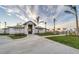 Exterior of the stylish clubhouse featuring a modern design and well-maintained landscaping at 14381 Heritage Landing Blvd, Punta Gorda, FL 33955