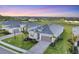 Beautiful exterior view of single Gathering home with grey tile roof and manicured green lawn at 14381 Heritage Landing Blvd, Punta Gorda, FL 33955