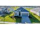 Charming single-Gathering home features a manicured lawn, beautiful landscaping and a two-car garage at 14381 Heritage Landing Blvd, Punta Gorda, FL 33955