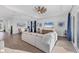Spacious living room with a large sectional, wood floors, recessed lighting, adjacent to the dining area at 14381 Heritage Landing Blvd, Punta Gorda, FL 33955