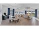 Open-concept living space combining the dining and living rooms with modern furnishings, recessed lighting, and neutral tones at 14381 Heritage Landing Blvd, Punta Gorda, FL 33955