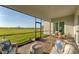 Inviting screened-in patio with stylish outdoor furniture and a picturesque view of the surrounding nature at 14381 Heritage Landing Blvd, Punta Gorda, FL 33955