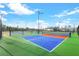 Bright and colorful pickleball courts offer a fun and active lifestyle with well-maintained surfaces and lighting at 14381 Heritage Landing Blvd, Punta Gorda, FL 33955