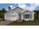 Charming single-story home with manicured landscaping and a two-car garage, perfect for modern living at 16290 Maya Cir, Punta Gorda, FL 33955