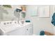 Functional laundry area with modern appliances and ample storage, making chores a breeze at 16290 Maya Cir, Punta Gorda, FL 33955