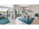 Open concept living and dining area with stylish decor, plenty of natural light, and backyard view at 16290 Maya Cir, Punta Gorda, FL 33955