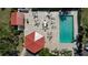 Aerial view of a community pool area with tables, chairs and lounge seating at 1780 Deborah Dr # 25, Punta Gorda, FL 33950