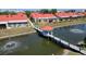Aerial view showcasing the property, pond with gazebo, and surrounding neighborhood at 1780 Deborah Dr # 25, Punta Gorda, FL 33950