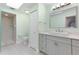 A pristine bathroom featuring modern vanity, sink, walk-in shower, toilet, and tile floors at 1780 Deborah Dr # 25, Punta Gorda, FL 33950