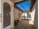 Welcoming covered entrance featuring brick pavers, a charming screen door, and ample natural light at 1780 Deborah Dr # 25, Punta Gorda, FL 33950