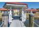 Inviting gazebo interior with seating overlooking the tranquil pond and surrounding community at 1780 Deborah Dr # 25, Punta Gorda, FL 33950