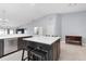 Open-concept kitchen featuring a large island with seating, stainless steel appliances, and ample storage space at 1780 Deborah Dr # 25, Punta Gorda, FL 33950