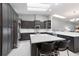 Modern kitchen with dark wood cabinets, stainless steel appliances, a large island, and a bright, airy atmosphere at 1780 Deborah Dr # 25, Punta Gorda, FL 33950