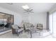 Bright sunroom living area with tile floors, skylight, ceiling fan, and casual seating at 1780 Deborah Dr # 25, Punta Gorda, FL 33950