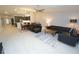 A bright and airy living room with an open floor plan, comfortable seating and view into the kitchen at 1780 Deborah Dr # 25, Punta Gorda, FL 33950