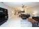 A spacious open-concept living room with tile floors, dining area, kitchen and access to other rooms at 1780 Deborah Dr # 25, Punta Gorda, FL 33950