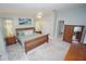A relaxing main bedroom with a ceiling fan, side tables with lamps and tranquil colored walls at 1780 Deborah Dr # 25, Punta Gorda, FL 33950