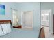 Bedroom features a side table, closet, and an ensuite bathroom at 1780 Deborah Dr # 25, Punta Gorda, FL 33950