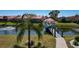 Picturesque pond view with a charming gazebo and walkway, perfect for relaxation at 1780 Deborah Dr # 25, Punta Gorda, FL 33950