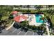 Inviting community pool area with ample seating, lush landscaping, and a well-maintained pool at 1780 Deborah Dr # 25, Punta Gorda, FL 33950