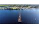 Aerial view of pier over blue water at 21194 Edgewater Dr, Port Charlotte, FL 33952