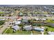 Aerial view of a waterfront community featuring manicured lawns, and serene canal access at 21194 Edgewater Dr, Port Charlotte, FL 33952