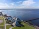 Aerial view of the community's pool, fishing pier, and park area along the bay at 21194 Edgewater Dr, Port Charlotte, FL 33952