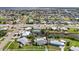 Aerial view of a waterfront community featuring manicured lawns, and serene canal access at 21194 Edgewater Dr, Port Charlotte, FL 33952