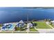 Aerial view of pier, swimming pool, beachside park with ocean views and recreation at 21194 Edgewater Dr, Port Charlotte, FL 33952