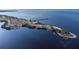 An aerial view of a park featuring a pier and boat slips on the water at 21194 Edgewater Dr, Port Charlotte, FL 33952
