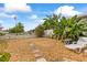 Landscaped backyard featuring stone pathway, and tropical foliage at 21194 Edgewater Dr, Port Charlotte, FL 33952