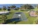 Aerial view of outdoor basketball court and recreation area with the ocean in the background at 21194 Edgewater Dr, Port Charlotte, FL 33952