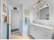 Well-lit bathroom with a white vanity, marble countertop, and blue accents, showcasing a clean and functional design at 21194 Edgewater Dr, Port Charlotte, FL 33952