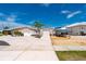 View of detached garage and boat on trailer in the driveway at 21194 Edgewater Dr, Port Charlotte, FL 33952
