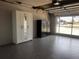 Open garage with polished flooring, storage, and a clear view of the street at 21194 Edgewater Dr, Port Charlotte, FL 33952