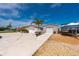 Exterior view showing boat parking on a gravel bed next to the garage and circular driveway at 21194 Edgewater Dr, Port Charlotte, FL 33952