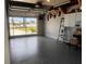 Bright garage space with an open door view, smooth floors, and wall decorations at 21194 Edgewater Dr, Port Charlotte, FL 33952