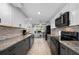 Spacious kitchen with granite countertops, stainless steel appliances, and ample storage at 21194 Edgewater Dr, Port Charlotte, FL 33952