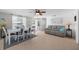 Open-concept living area with a view of the front porch and a comfortable seating arrangement at 21194 Edgewater Dr, Port Charlotte, FL 33952