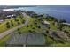 Beautiful community park featuring a playground, tennis courts, and sports areas with scenic water views at 21194 Edgewater Dr, Port Charlotte, FL 33952