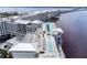 Aerial view of a stunning rooftop pool and sun deck with lounge chairs and city views at 21194 Edgewater Dr, Port Charlotte, FL 33952