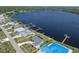 Waterfront home with dock and beautiful water views on a sunny day, and outlined lot at 2308 Harbour Dr, Punta Gorda, FL 33983
