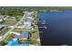 Waterfront home with dock and beautiful water views on a sunny day, and outlined lot at 2308 Harbour Dr, Punta Gorda, FL 33983