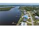 Aerial view of the property featuring a waterfront location with a boat dock at 2308 Harbour Dr, Punta Gorda, FL 33983