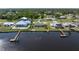 Waterfront property with a private dock and meticulously maintained landscaping at 2308 Harbour Dr, Punta Gorda, FL 33983