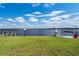 Backyard view with grass and water views at 2308 Harbour Dr, Punta Gorda, FL 33983